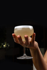 a wonderful alcoholic cocktail in a woman's hand