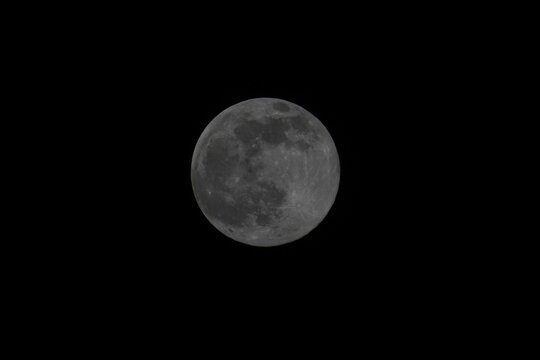 Stunning image of a large full moon illuminating the night sky