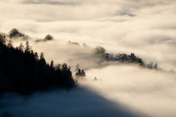 Beautiful sunset with a sea of clouds over the mountains in Austria. Vorarlberg