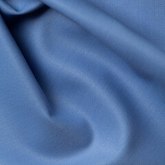 Close up of blue satin fabric texture. Abstract background and texture for design
