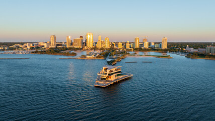 Sunrise at Saint Petersburg, Florida pier with downtown skyline in the background, aerial perspective.