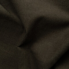 Close up of crumpled dark brown fabric textured background