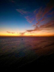 Fototapeta na wymiar Stunning view of a sunrise illuminating the horizon over the vast expanse of the ocean in Hawai