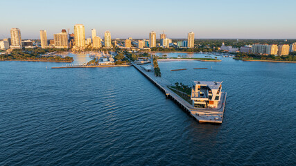 Sunrise at Saint Petersburg, Florida pier with downtown skyline in the background, aerial perspective.