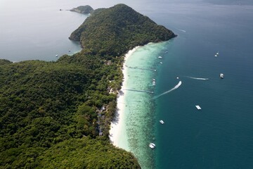 Aerial view of a tropical island with white sandy beaches
