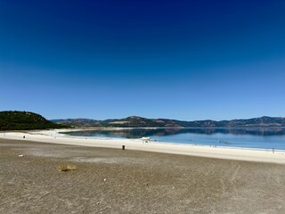 Scenic shot of Burdur Salda Lake under the blue sky (Salda Golu, Saldives), Turkey