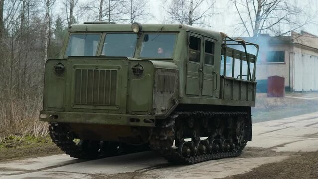 Soviet medium-track artillery tractor from the mid-20th century, designed for towing trailers, transporting people, and cargo.