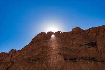 Brreathtaking view of the towering Garden of the Gods rock formations illuminated by the sun