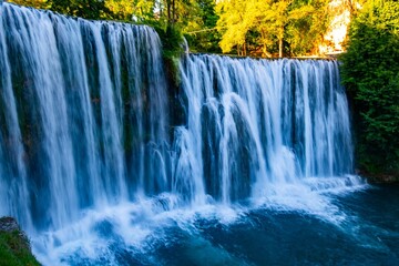 Idyllic scene of an enchanting waterfall cascading down in Jajce, Bosnia and Herzegovina
