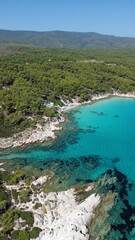Fototapeta na wymiar Aerial view of the shoreline of Mega Portokali Beach, Sitonia, Halkidiki, Greece