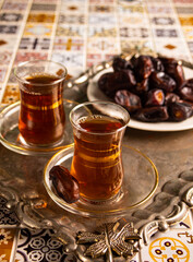 Traditional Arabic Ramadan tea, islamic concept Ramadan Kareem and Eid Mubarak with dates.