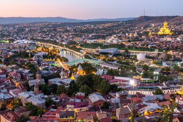 Panoramic view of Tbilisi city from Narikala fortress after the sunset - obrazy, fototapety, plakaty