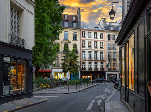 Cozy street in Paris, France. Architecture and landmark of Paris. Sunset Paris cityscape.
