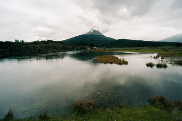 lake in Bahia Lapataia amidst mountains at Tierra del Fuego