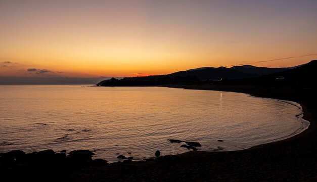 Scenic view of sunset over Ammolofoi Beach, Kavala in Greece