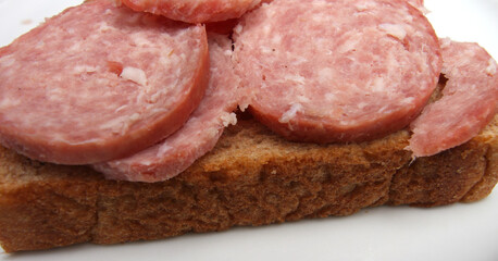bread with salami. snack made with salami and bread. meal details.