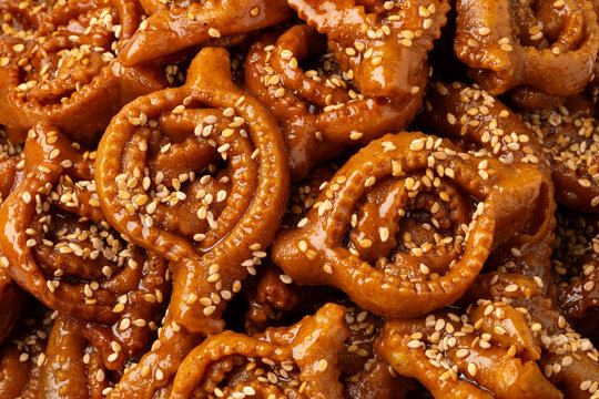 Traditional Moroccan fresh baked chebakia close up for Ramadan full frame as background