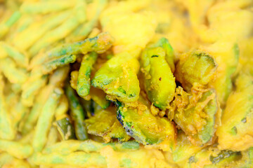 Eggplant slices and long beans dipped in flour and fried