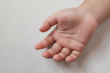 Child's palm on white background and copy space