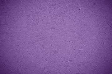 Background texture of a purple grunge concrete. Free space