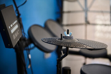 Modern interior of a home music studio and black cymbals of drum set. Percussion musical instrument
