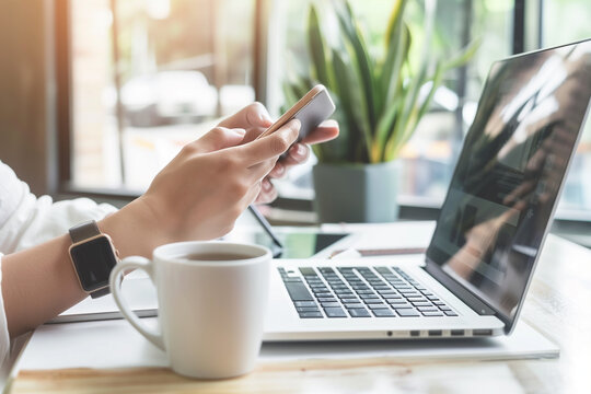 Businesswoman in office working analyzing business document with financial graph, market report on smartphone and laptop, business data analysis online business concept