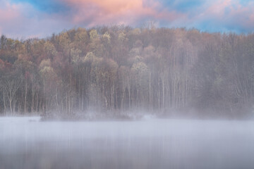 Foggy spring landscape at dawn of the shoreline of West Twin Lake, Kalamazoo, Michigan, USA