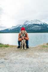 girl with her dog in the national park