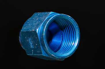 Inside threads of blue AN type hose fitting cap. Used in industrial, automotive, and aviation applications. Caps oil, hydraulic, fuel lines to prevent leaks during maintenance