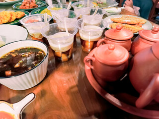 a menu for breaking the fast with some sweets and several cups of hot tea