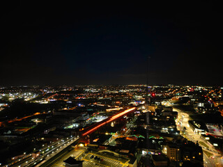 Fototapeta na wymiar Aerial Night View of Illuminated City Centre Buildings of Birmingham Central City of England United Kingdom. March 30th, 2024