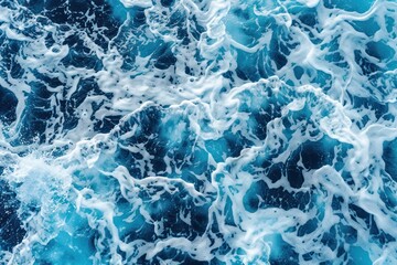 Fototapeta premium Background of blue sea water with foam and waves