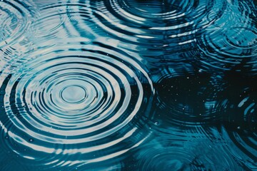 Geometric pattern mimicking ripples on water, overlapping circles, calming blues