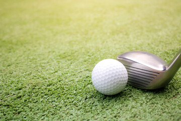 Golf ball placed on artificial grass.
