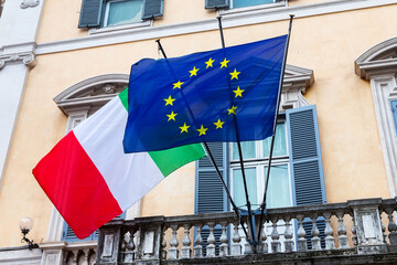 Italian and European union flags at building in Rome, Italy.