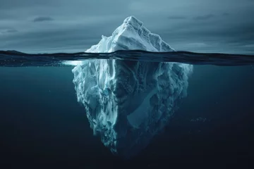 Fototapeten Iceberg floating on dark sea, large part visible underwater, smaller tip above surface © Anna