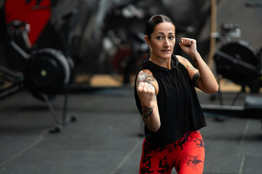 Female martial artist training in a gym