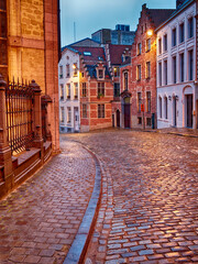 Old Streets of Bruxelles Belgium illuminated at dusk or dawn - obrazy, fototapety, plakaty