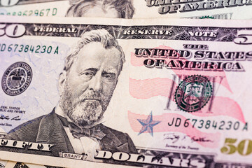 Dollar bills background.Fragment of 50 US dollar banknote for design purpose.Closeup of assorted...