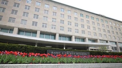 Front turning view of Harry S Truman Department of State building in Washington, DC on an overcast...