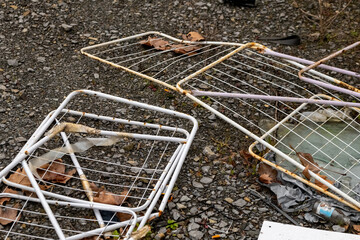 old rusty tumble dryers as waste