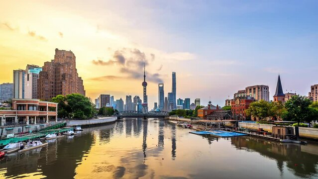 Time lapse of Shanghai modern downtown buildings and river at sunrise