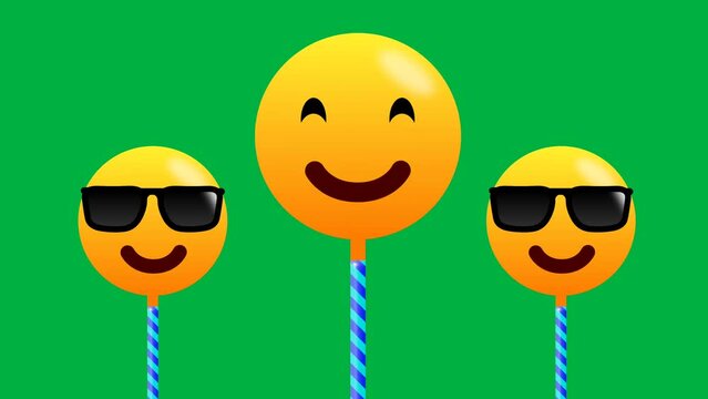 Smiling and cool emoji with swinging motion isolated on green background. Cute animation of sunglasses emoji.
