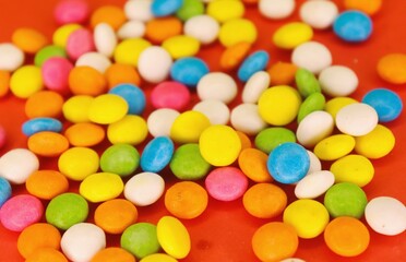 A focus colorful gems with red background