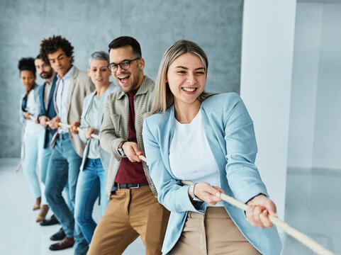 businessman man business young busineswoman woman office rope concept competition pull strength challenge teamwork effort pulling rivalry power struggle determination achievement startup