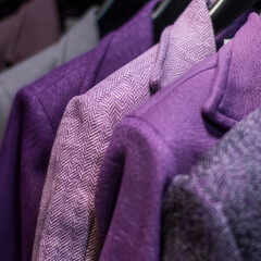 Women's jackets close-up in lilac color, hanging on a hanger