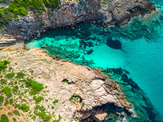 Areal drone view of the Arenal d'en Castell beach on Menorca island, Spain - 772455733