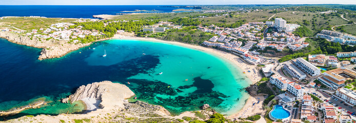 Areal drone view of the Arenal d'en Castell beach on Menorca island, Spain - 772456380