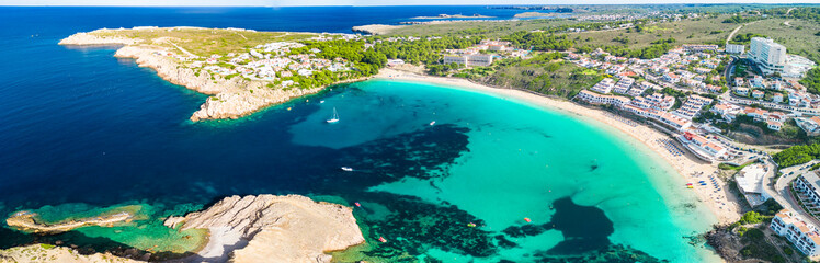 Areal drone view of the Arenal d'en Castell beach on Menorca island, Spain - 772457131