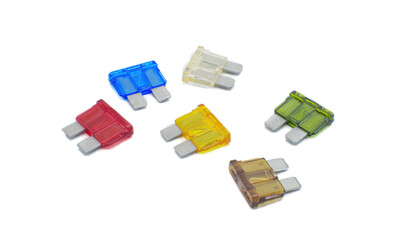 Assortment of different amp color code electrical automotive fuses isolated on white background....
